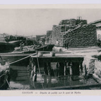 Antique postcard photo by Nadal -
Cholon, paddy depots on the docks of Mytho